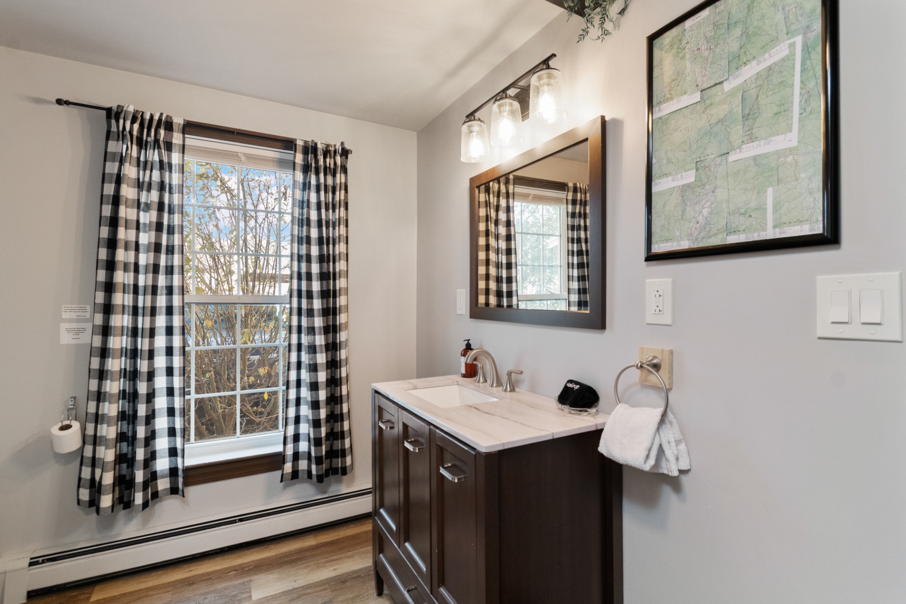 Bathroom vanity and mirror in the Long Trail Suite