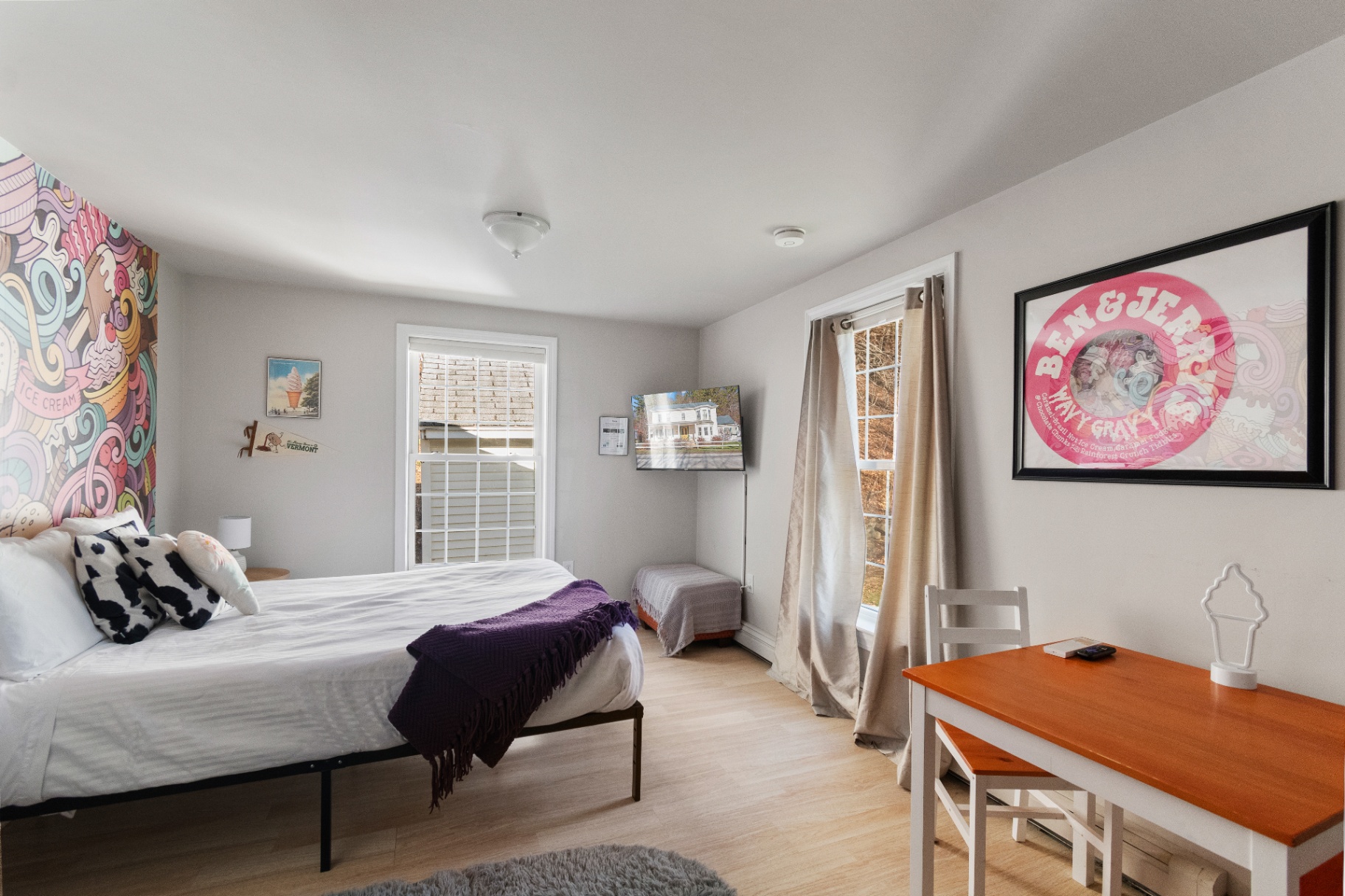 Bedroom with Ben & Jerry's Wavy Gravy poster and desk