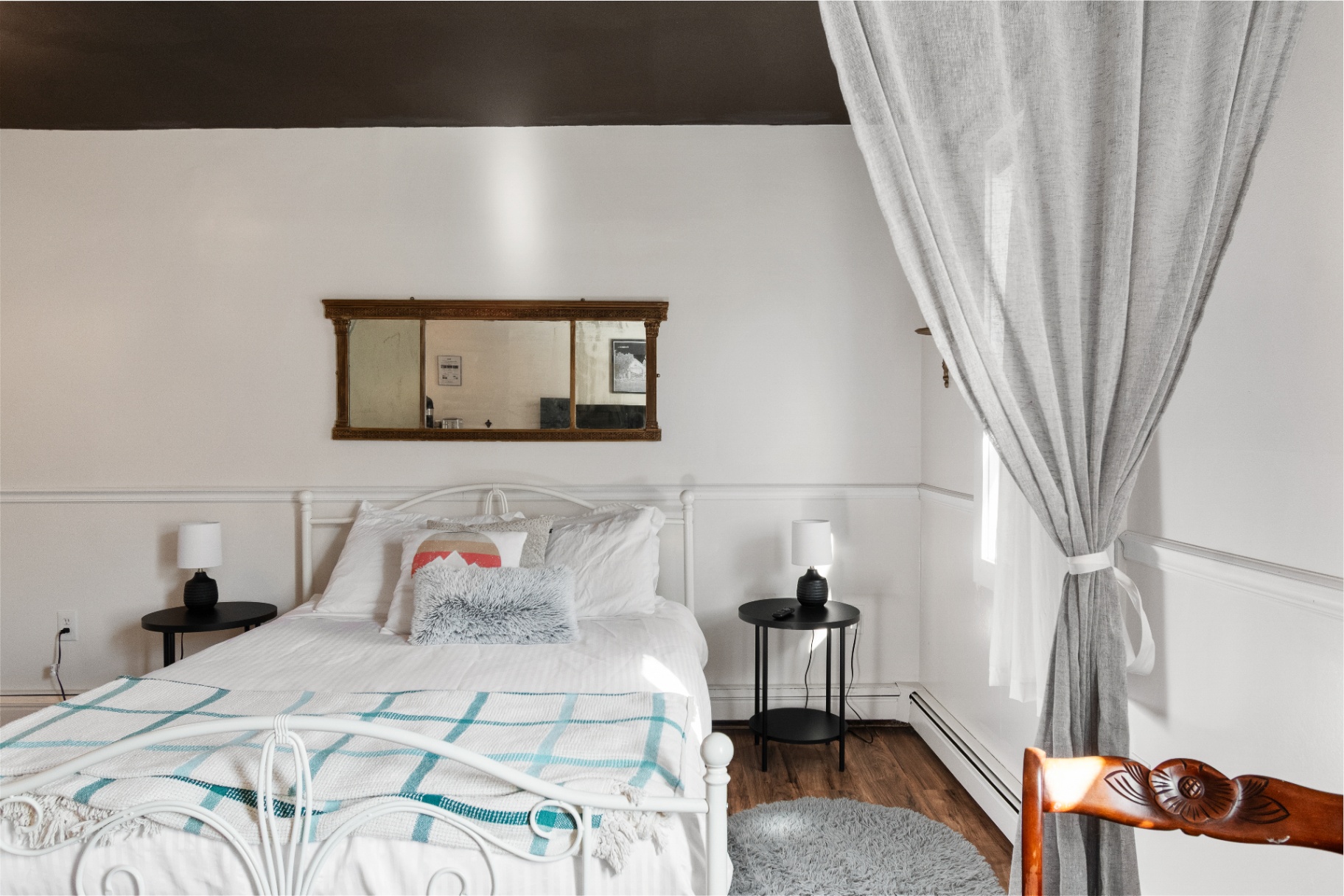 Woodstock Suite bed framed by curtains