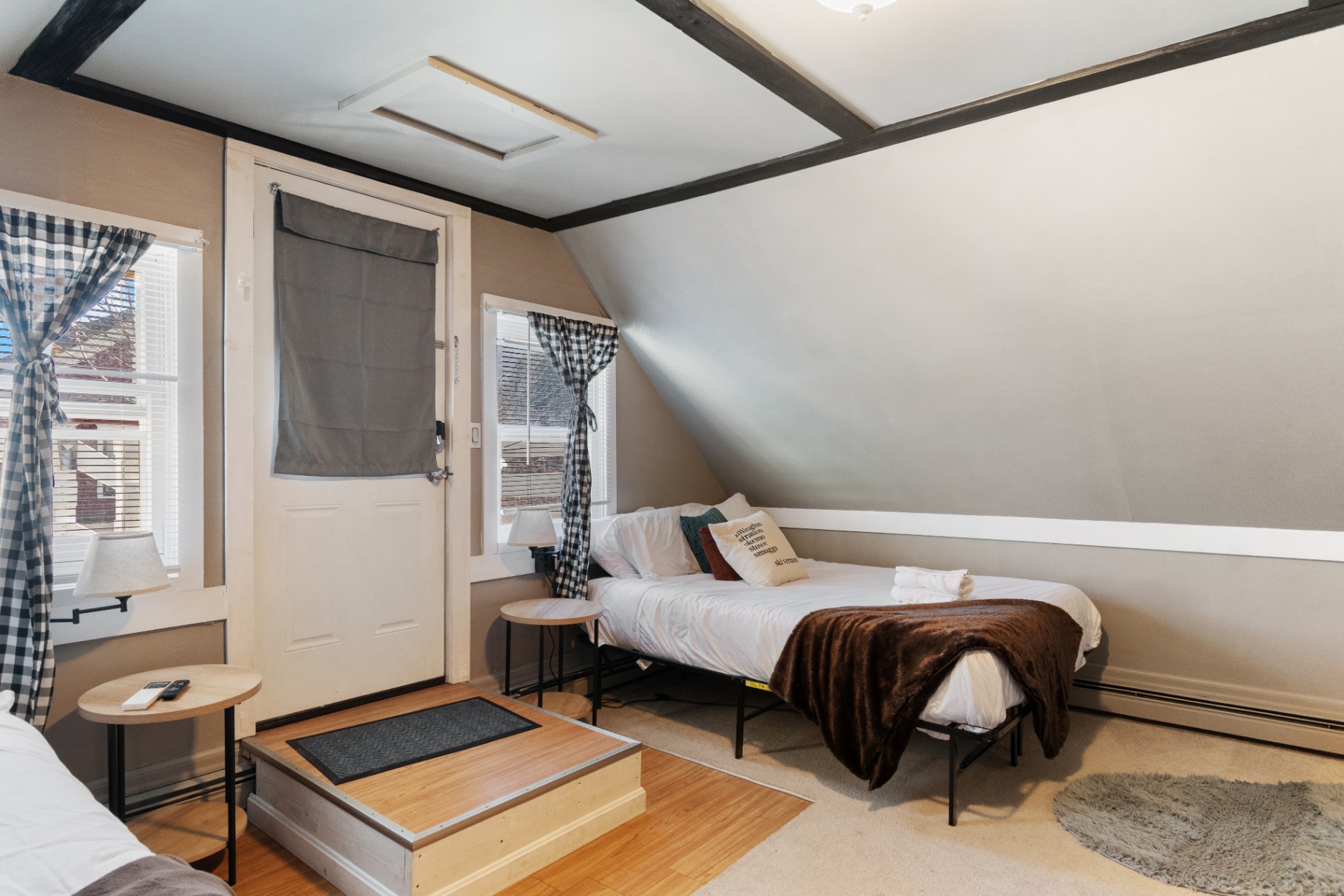 Twin bed nook with sloped ceiling